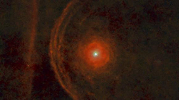 fuzzy, faint arcs on one side of star and fuzzy vertical line, see caption