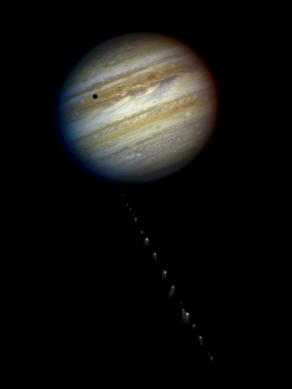 Shoemaker-Levy 9: Jupiter with dots heading toward the planet.