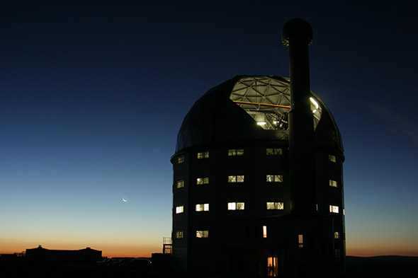 The Southern African Large Telescope (SALT) is the largest single optical telescope in the southern hemisphere and among the largest in the world. As Dartmouth is a partner in SALT, faculty and students have access to the telescope. Photo credit: Janus Brink, Southern African Large Telescope)
