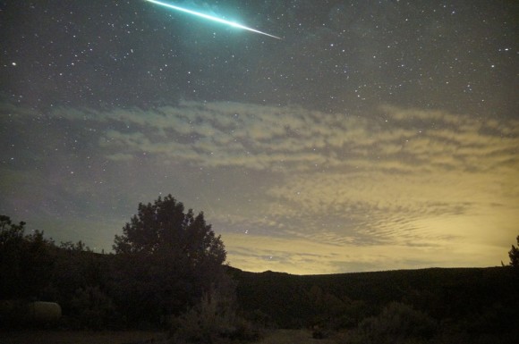 Mike Lewinski said this 2013 Perseid fireball was so bright that it illuminated the clouds.  Notice the greenish color.  Mike was at Embudo, New Mexico.  Thanks for posting!