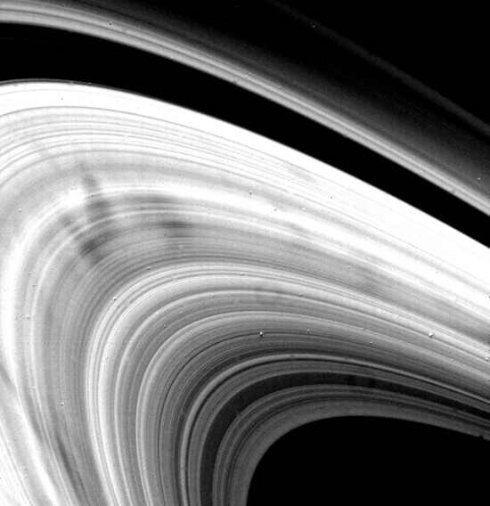 Close-up of Saturn's rings in black and white.