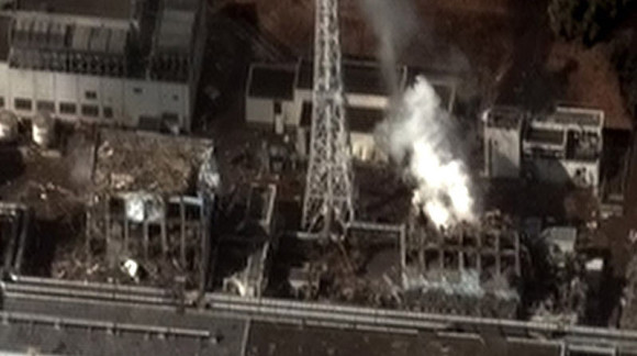 The Fukushima nuclear power plant after the March 11, 2011 Tohoku earthquake and tsunami.  Three of the reactors at the plant overheated, causing meltdowns that eventually led to explosions, which released large amounts of radioactive material into the air.  Image via Digital Globe via Wikimedia Commons.