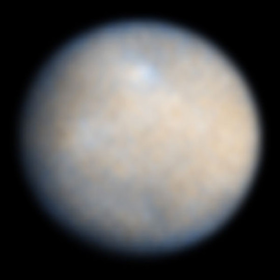 This is a NASA Hubble Space Telescope color image of Ceres, the largest object in the asteroid belt. Features on Ceres' surface include brighter and darker regions that could be asteroid impact features. These Hubble observations were made in visible and ultraviolet light between December 2003 and January 2004. Image via Hubble Space Telescope.