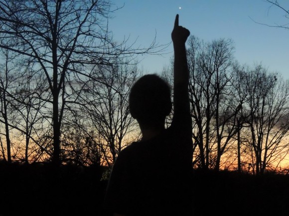 EarthSky Facebook friend Mary C. Cox captured this photo of her nephew pointing at Venus in bright twilight on December 29, 2013. Thank you, Mary!