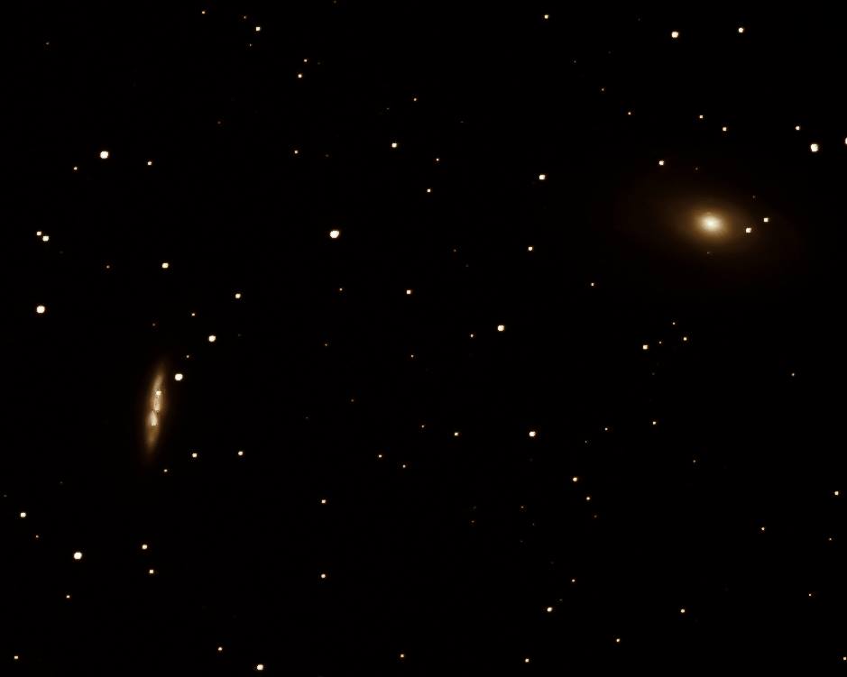 M82 (Cigar Galaxy) is nearly always mentioned with another object, known as M81 (Bode's Nebula). Here are the two M-objects together (M82 is on the left). Our friend Ken Christison captured this beautiful image. He said it's a stack of 15 images of 30 seconds.