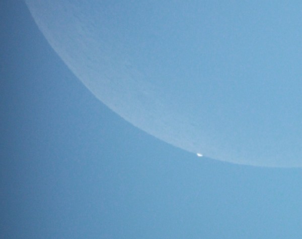 Almost gone.  February 26, 2014 Venus occultation by the moon.  Photo by Ravindra Aradhya in Bangalore, India.