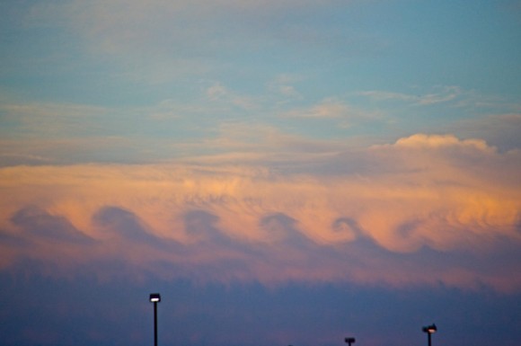 Upside down wave clouds at sunset.