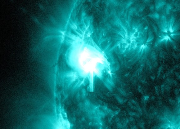 The bright light on the left side of the sun shows an M5.2-class solar flare on May 8, 2014.   Image via NASA/SDO 