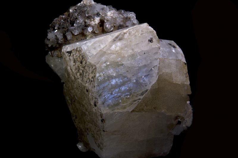 A translucent white, irregularly shaped crystal.