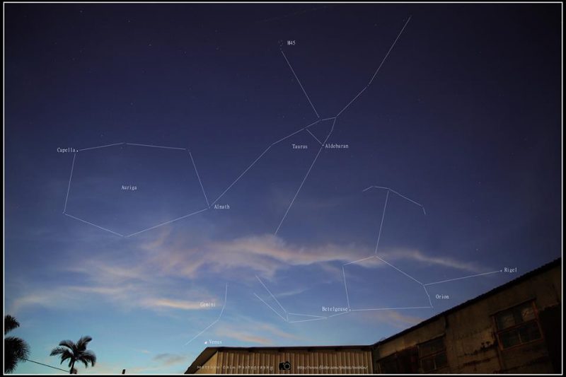A lightening sky, with the stars of Orion and Taurus labeled.