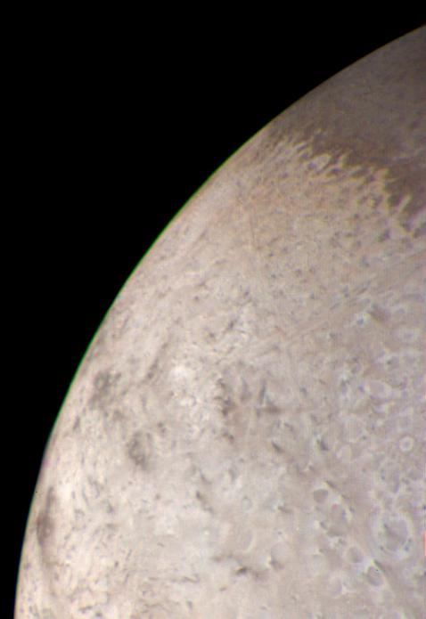 The limb (edge) of Triton in color via Voyager 2.