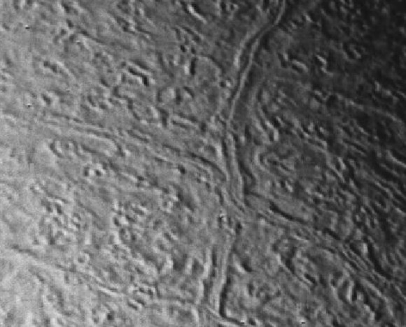 On Triton, cantaloupe terrain with faulting.  Image via Voyager 2.