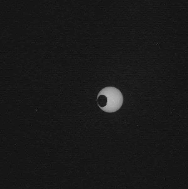 Photo of Mars moon Phobos in front of the sun.  Image Credt: NASA / JPL / Malin Space Science Systems. Mars Science Laboratory Curiosity.  