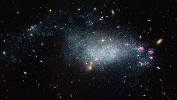This image from the NASA/ESA Hubble Space Telescope shows a cosmic oddity, dwarf galaxy DDO 68. This ragged collection of stars and gas clouds looks at first glance like a recently-formed galaxy in our own cosmic neighborhood. But, is it really as young as it looks?