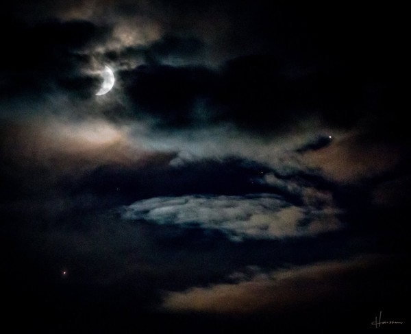 Keith Hanssen caught the planets and moon on August 31 through thin clouds over southwestern Montana.