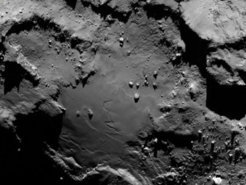 The group of boulders in the center of this image reminded scientists of the Giza Necropolis. The largest boulder has therefore been named Cheops.   Image via ESA/Rosetta/MPS for OSIRIS Team MPS/UPD/LAM/IAA/SSO/INTA/UPM/DASP/IDA