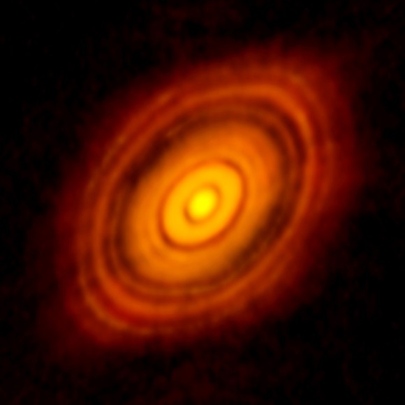 View larger. | ALMA image of the young star HL Tau and its protoplanetary disk. This best image ever of planet formation reveals multiple rings and gaps that herald the presence of emerging planets as they sweep their orbits clear of dust and gas. Credit: ALMA (NRAO/ESO/NAOJ); C. Brogan, B. Saxton (NRAO/AUI/NSF)   