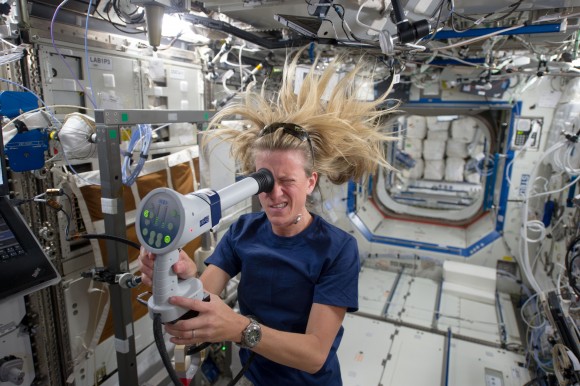 NASA astronaut Karen Nyberg uses a fundoscope to image her eye while in orbit. Image credit: NASA