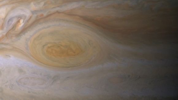 Research suggests effects of sunlight produce the color of Jupiter's Great Red Spot. The feature's clouds are much higher than those elsewhere on the planet, and its vortex nature confines the reddish particles once they form. Image credit: NASA/JPL-Caltech/ Space Science Institute