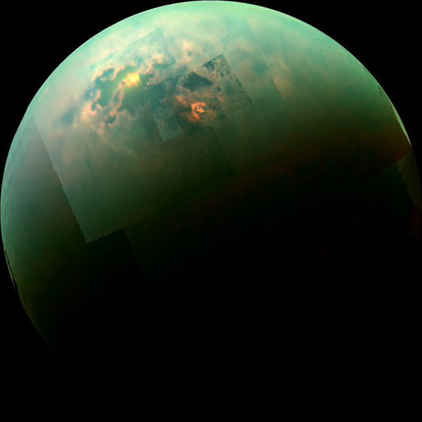 View larger. | The yellow smudge in this image is sunglint from the liquid seas of Saturn's largest moon Titan.  Image via NASA's Jet Propulsion Laboratory.