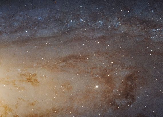 Closeup of a spiral arm of the Andromeda galaxy, with dust clouds and smaller features visible.