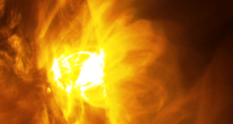 Giant magnetic loops dance on the sun’s horizon as a solar flare erupts on January 12-13, 2015. Image via NASA/SDO.
