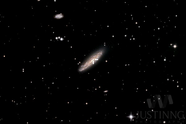 View larger. | The crosshairs mark the location of the supernova in the galaxy NGC 4666.  Photo taken January 2, 2015 by Justin Ng of Singapore.  Visit Justin Ng's website.