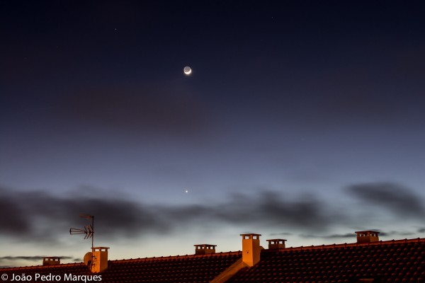 João Pedro Marques caught bright Venus and the waxing moon on the evening of January 22, 2015, from Portugal.  The reddish 