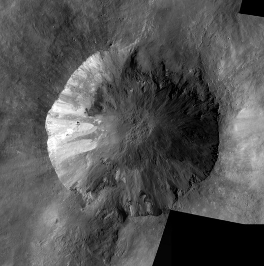 Another look at the crater Cornelia on Vesta.  Mosaic of Low-Altitude Mapping Orbit images of Cornelia crater, Vesta This mosaic is composed of five images of Vesta captured by Dawn during its Low Altitude Mapping Orbit phase. The images were taken between January 11 and March 13, 2012. At full resolution, it is about 20 meters per pixel, covering an area about 30 kilometers across.