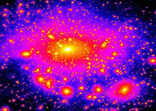 This image is a 2007 supercomputer simulation illustrating dark matter satellites as bright clumps around our Milky Way galaxy. Image via stanford.edu