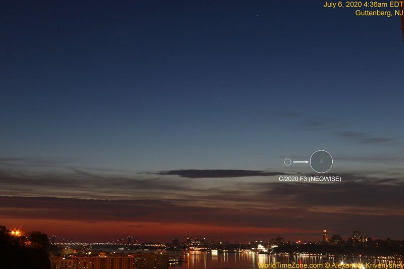 A faint comet in the twilight dawn sky over New York City's glittering skyline.