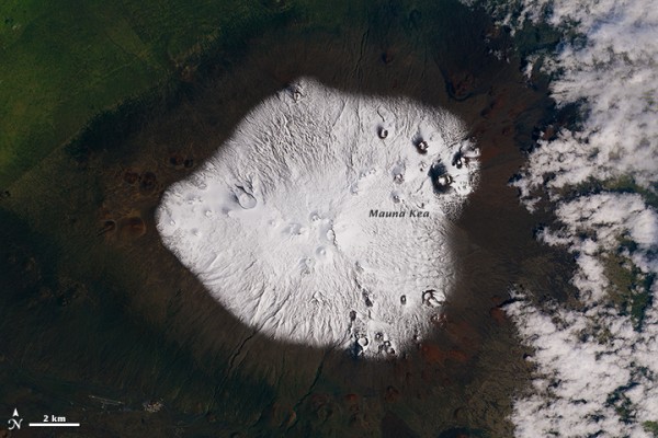 The Operational Land Imager (OLI) on Landsat 8 captured a view of the snow-capped summit on March 10, 2015   Image via NASA Earth Observatory and Joshua Stevens, using Landsat data from the U.S. Geological Survey.  