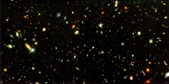 What pushes galaxies like these in the Hubble deep field apart? Image credit: NASA and A. Riess (STScI)