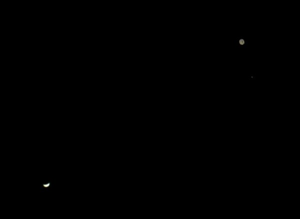 If you turned a telescope on Venus and Jupiter, you would see Venus in a crescent phase ... while Jupiter is a large, striped ball.  Photo by Max Corneau on June 30, 2015.