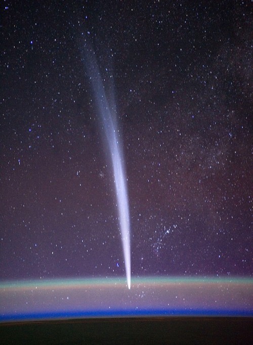 Comet Lovejoy is visible near Earth's horizon behind airglow in this nighttime image photographed by NASA astronaut Dan Burbank, Expedition 30 commander, onboard the International Space Station on Dec. 22, 2011.