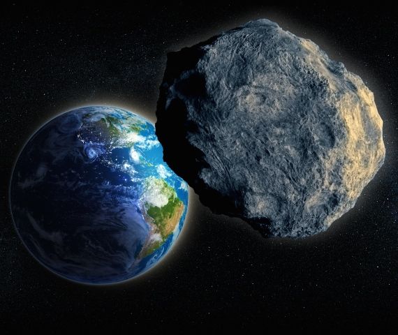 Artist's concept of a large asteroid passing Earth, via Shutterstock.