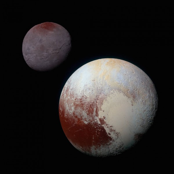 This composite of enhanced color images of Pluto (lower right) and Charon (upper left), was taken by NASA’s New Horizons spacecraft as it passed through the Pluto system on July 14, 2015. This image highlights the striking differences between Pluto and Charon. The color and brightness of both Pluto and Charon have been processed identically to allow direct comparison of their surface properties, and to highlight the similarity between Charon’s polar red terrain and Pluto’s equatorial red terrain. Pluto and Charon are shown with approximately correct relative sizes, but their true separation is not to scale. The image combines blue, red and infrared images taken by the spacecraft’s Ralph/Multispectral Visual Imaging Camera (MVIC). Image credit: NASA/JHUAPL/SwRI