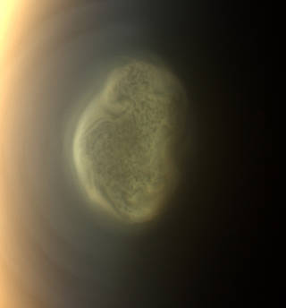 This 2012 close-up offers an early snapshot of the changes taking place at Titan’s south pole. Cassini’s camera spotted this impressive cloud hovering at an altitude of about 186 miles (300 kilometers). Cassini’s thermal infrared instrument has now detected a massive ice cloud below it. Image credit: NASA/JPL-Caltech/Space Science Institute