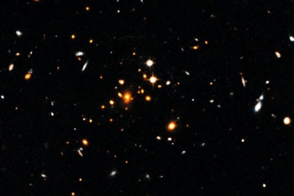 Cluster  IDCS 1426, shown here, is the most massive cluster of galaxies yet discovered in the first 4 billion years after the Big Bang. Credit: NASA, European Space Agency, University of Florida, University of Missouri, and University of California