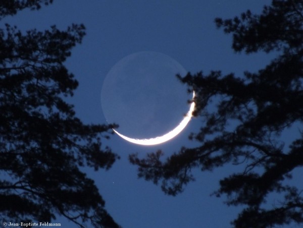 View larger. | Young moon on February 10, 2016 by Jean-Baptiste Feldmann in France.  