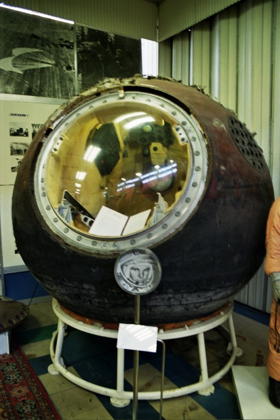 Spherical space capsule with large round window, barely big enough for one person.