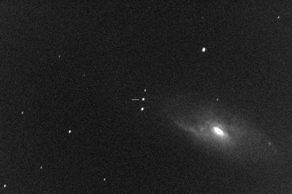 Composite image of the record comet P/2016 BA14 Panstarrs meeting the M106 galaxy, as seen from our perspective, on March 24.  Image via Gianluca Masi, Virtual Telescope Project - Italy. 