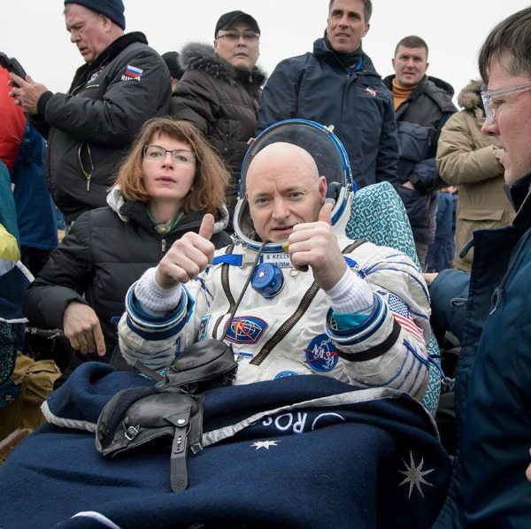 Two thumbs up from NASA Astronaut Scott Kelly, seen resting in a chair outside of the spacecraft just minutes after he and Russian cosmonauts Mikhail Kornienko and Sergey Volkov of Roscosmos landed in a remote area near the town of Zhezkazgan, Kazakhstan on Wednesday, March 2, 2016 (Kazakh time).  Photo: NASA/Bill Ingalls 