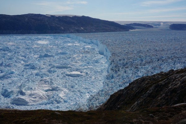 The 100-meter terminal ice cliff of Helheim Glacier in Southeast Greenland, which is retreating rapidly. DeConto and Pollard say processes like this on Greenland could become more widespread in Antarctica if thick parts of the ice sheet at the ocean’s edge begin losing their protective ice shelves. Photo: Knut Christianson, University of Washington