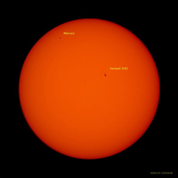 Large deep orange sun with Mercury as a tiny black dot and a small splotch labeled sunspot