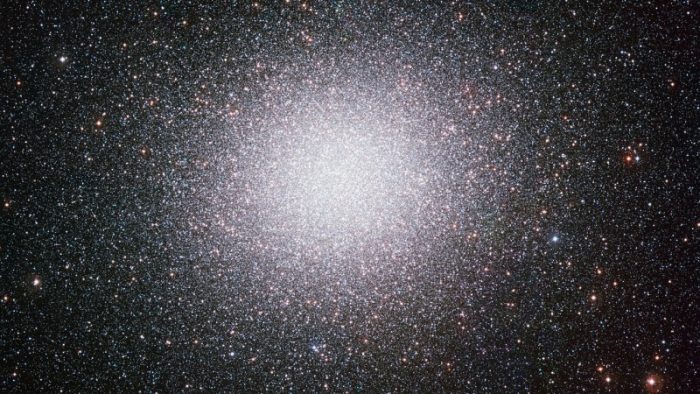 Dense ball of millions of stars, fading to less density at the edges.