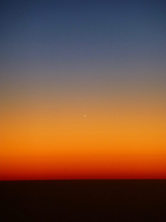 Venus and Mercury - and the star Regulus - are deep in evening twilight. This is Venus, caught from a plane over southern Oregon, on July 28, 2016. Photo by Gemini Brett.