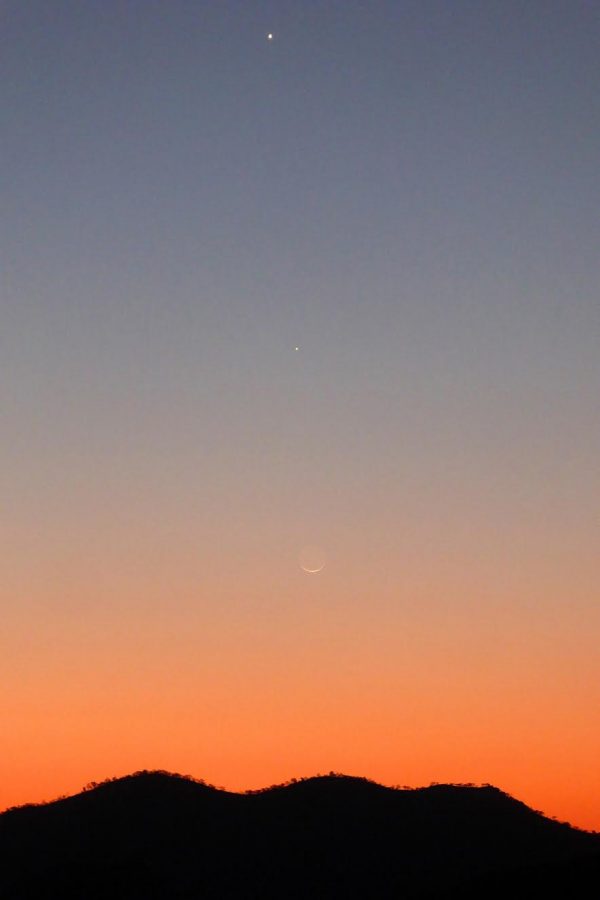 Peter Lowenstein in Mutare, Zimbabwe took this photo - and the one below. These two photos show the movement of the moon with respect to the evening planets.  Jupiter is the fainter one, lower in the sky.  Venus is higher up and brighter. The moon moves toward the east in Earth's sky, so passed Jupiter on September 2 and Venus on September 3.
