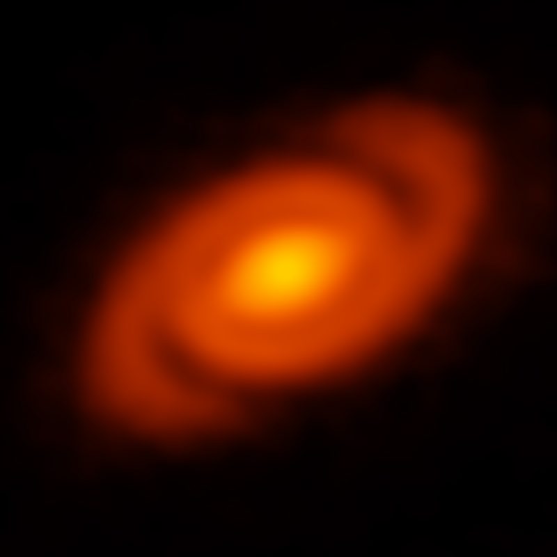 ALMA discovered sweeping spiral arms in the protoplanetary disk surrounding the young star Elias 2-27. This spiral feature was produced by density waves – gravitational perturbations in the disk. Credit: B. Saxton (NRAO/AUI/NSF); ALMA (ESO/NAOJ/NRAO)