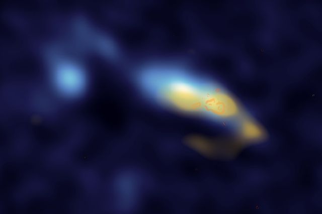 In the galaxy II Zw 40, dust (shown in yellow) is strongly associated with clusters of stars (shown in orange). UCLA researchers have used new observations of this galaxy to confirm that these stars are creating enormous amounts of dust. Image via UCLA.